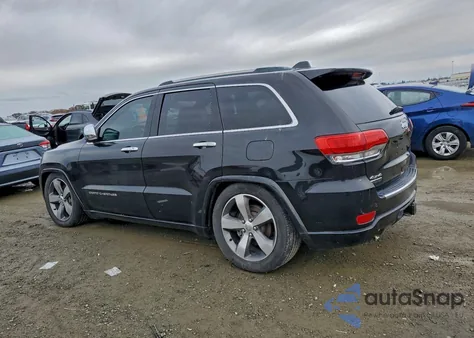 2014 Jeep Grand Cherokee Overland z USA, uszkodzony, nr VIN 1C4RJFCM4EC521167